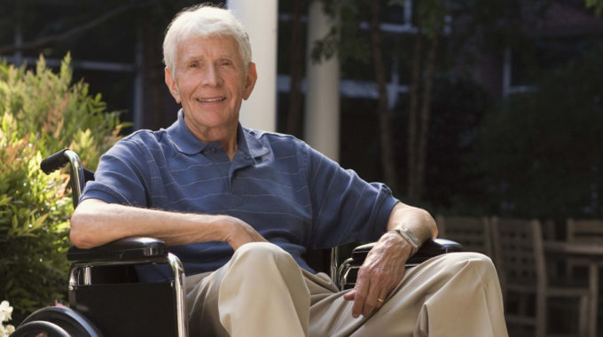 Homebound Medicare Beneficiary Sitting In Front Of His Home In A Wheelchair