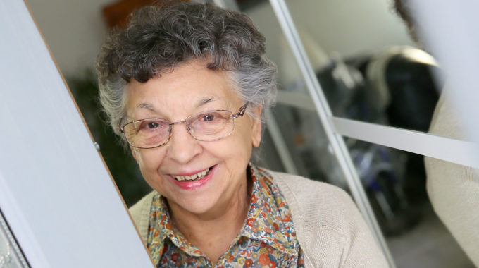 Senior Greeting Her Home Care Aide At The Door.