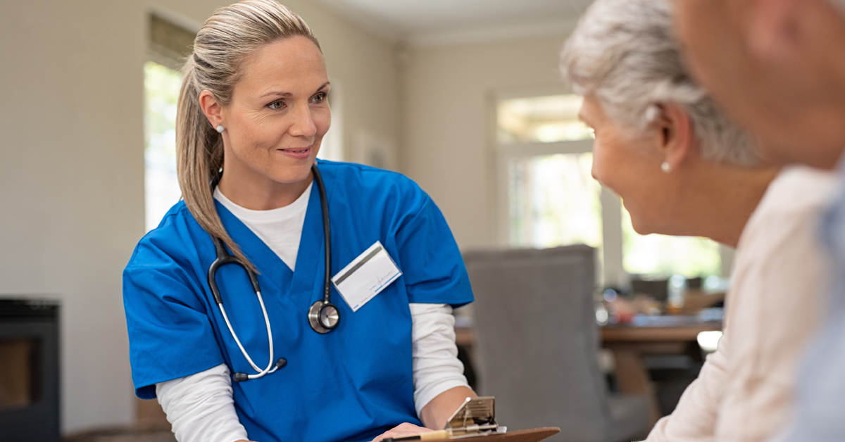 Nursing Speaking With An Elderly Couple.